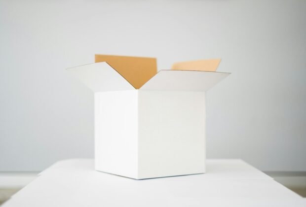 Open unbranded white product packaging box