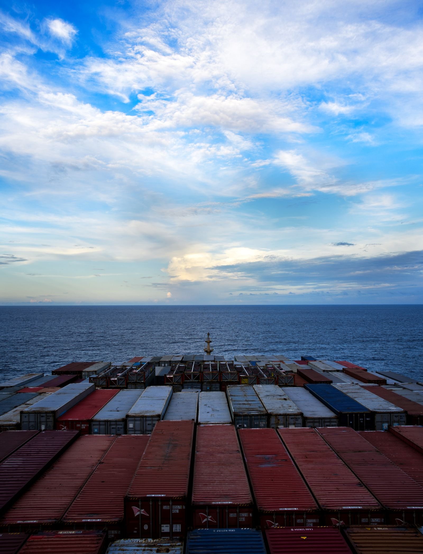 Container ship transporting cargo across the ocean