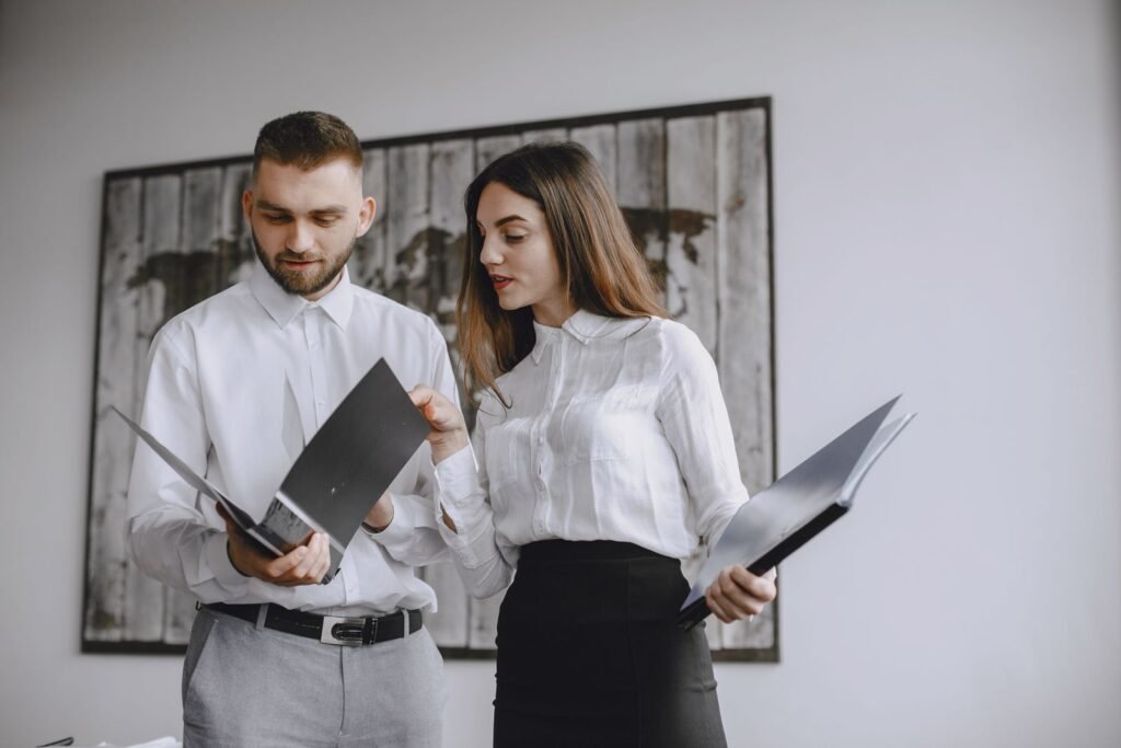 Two colleagues reviewing sourcing documents