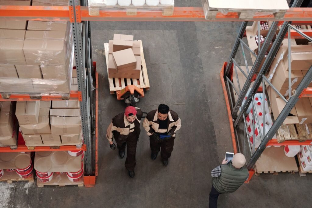 Warehouse team preparing cartons and pallets